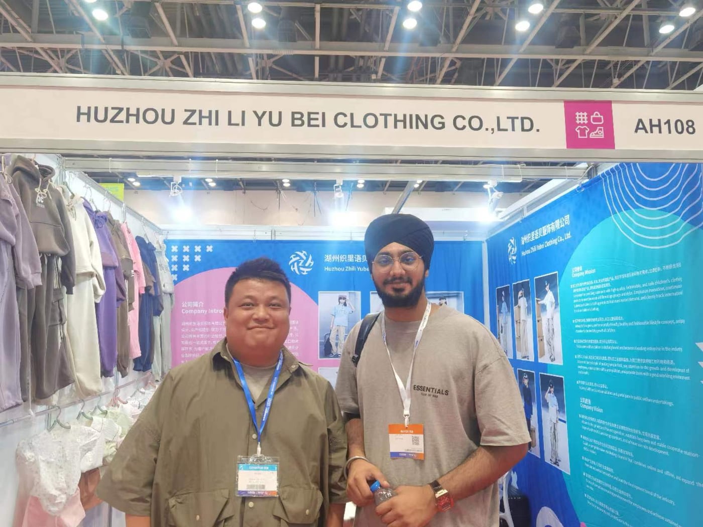 Yubei Apparel representative meeting an international buyer at the Guangzhou Canton Fair