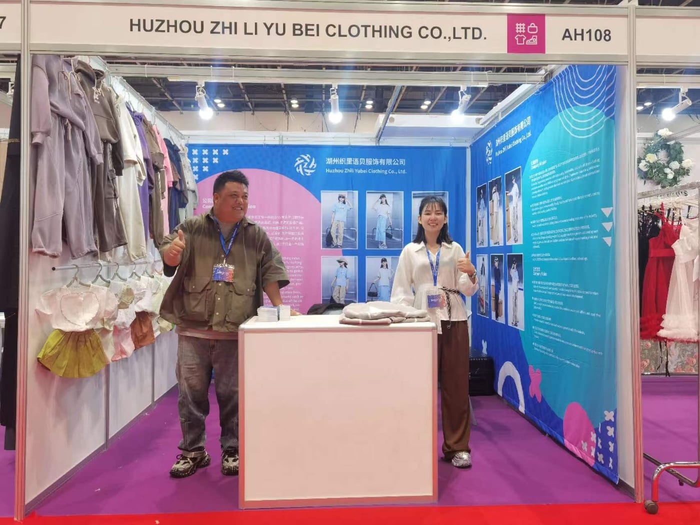 Yubei Apparel representatives presenting their booth at the Guangzhou Canton Fair