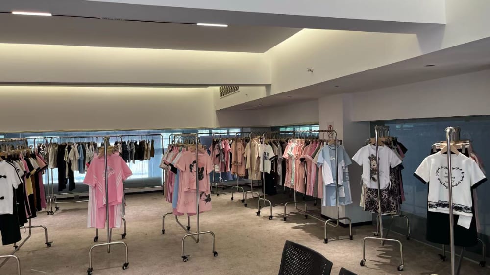 Children's clothing collections displayed inside the Yubei showroom in Zhili